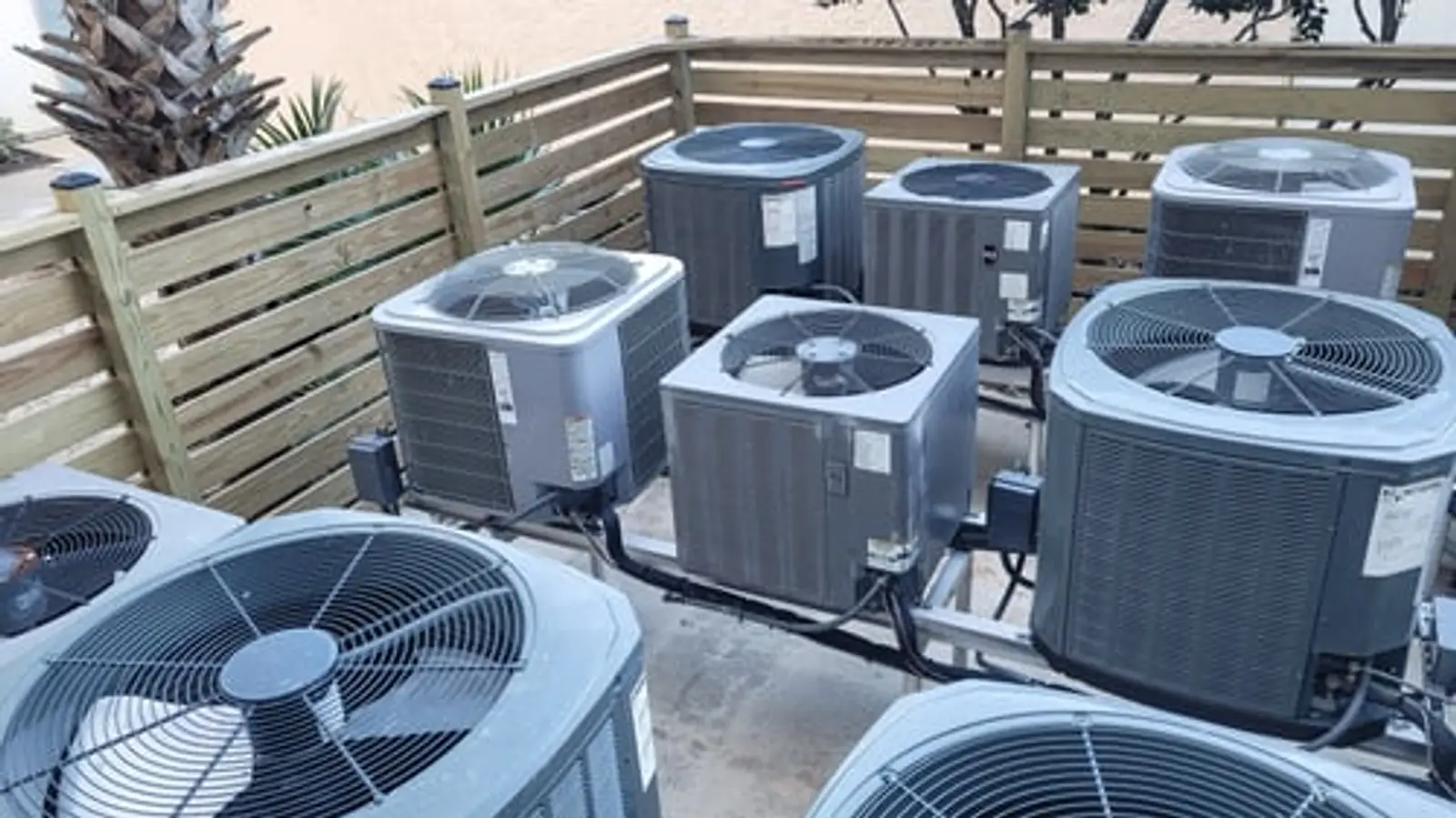 Bank of central air conditioning condensers installed by EasyAC Installers in the Rio Grande Valley